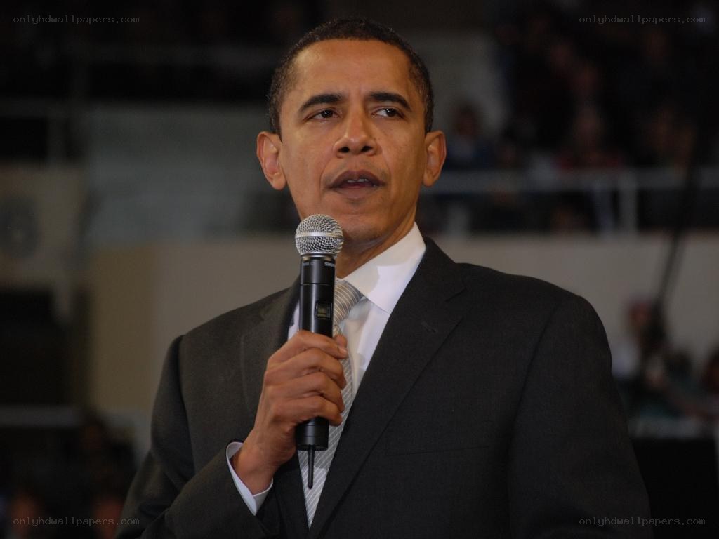 Barack Obama speaking into microphone