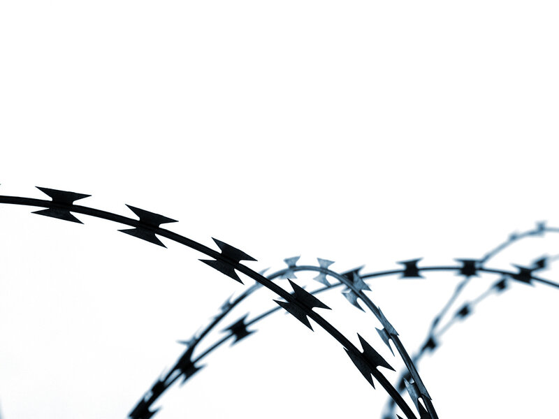 barbed wire against white background