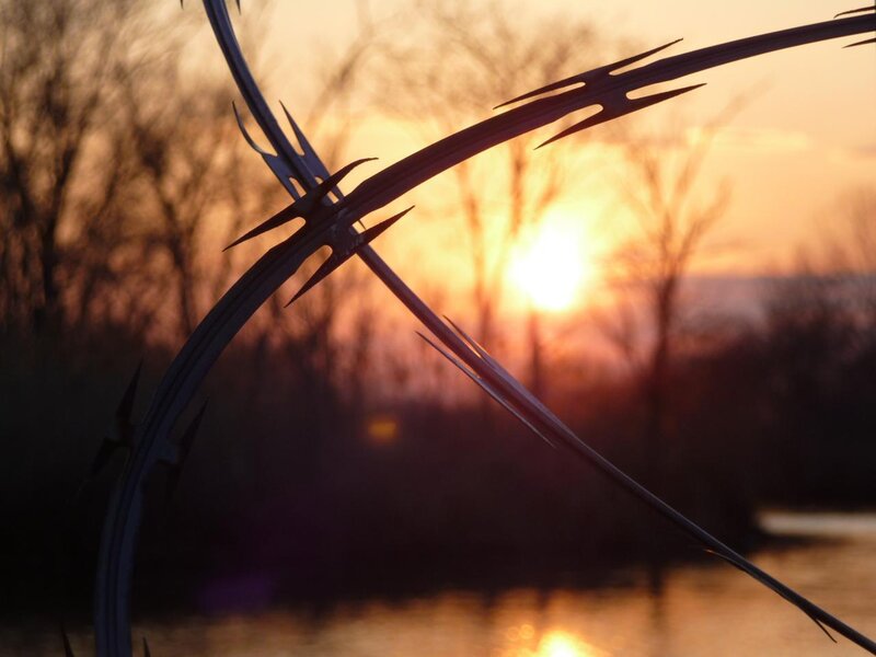Barbed Wire at Sunset — Orange, Dramatic