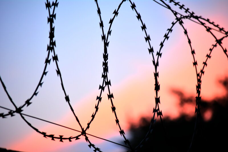 Barbed Wire Fence — Blue, Dramatic, Sunset