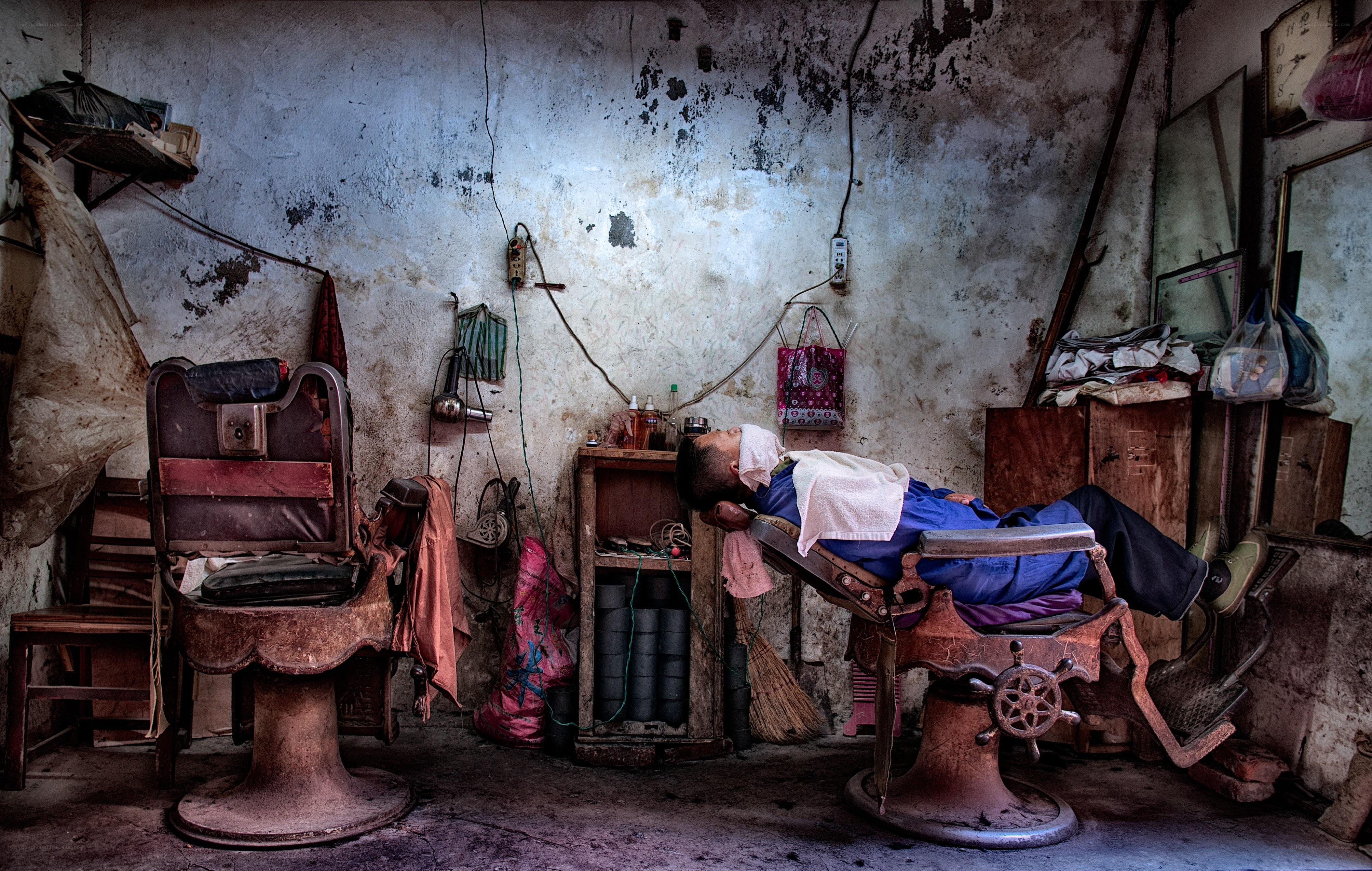 Barber sleeping in shop
