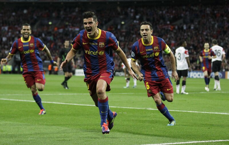Barcelona players celebrate a goal