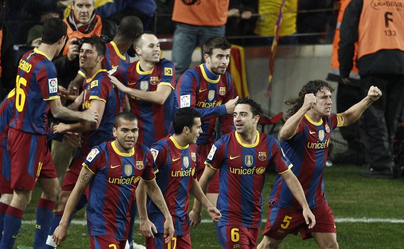Barcelona players celebrate on field