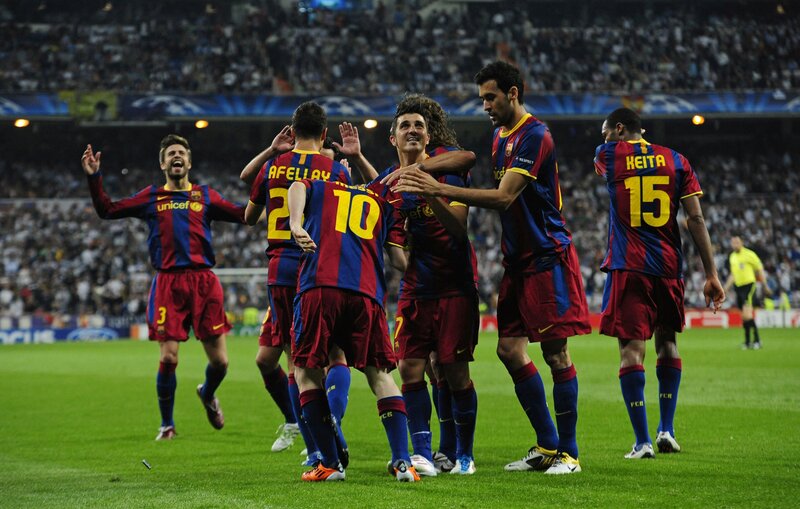 Barcelona players celebrate on field
