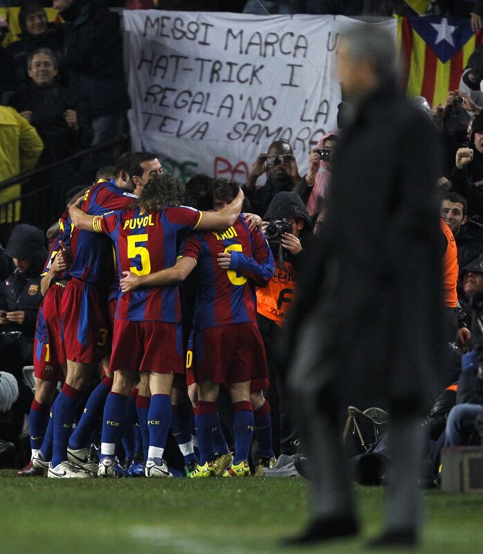 Barcelona players celebrate on field