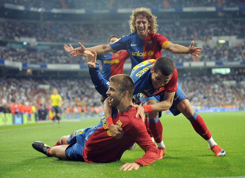 Barcelona players celebrate on field