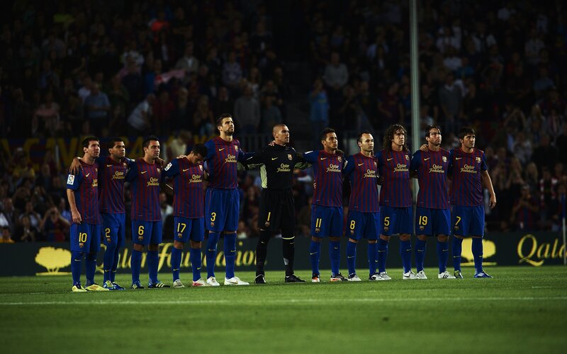 Barcelona players line up before match