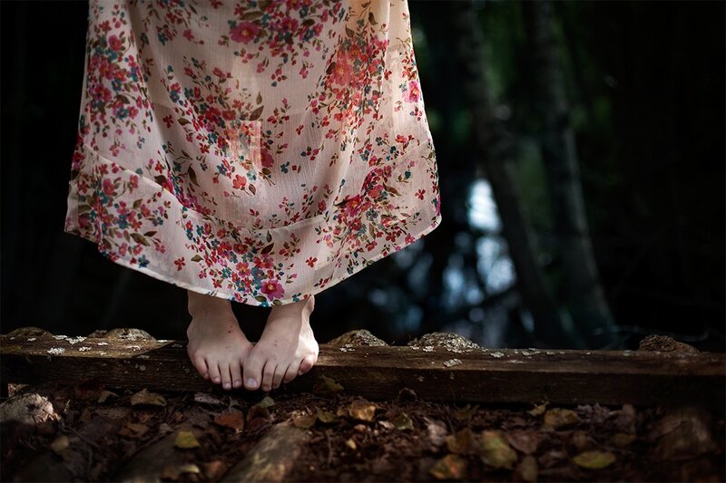 bare feet on a wooden beam