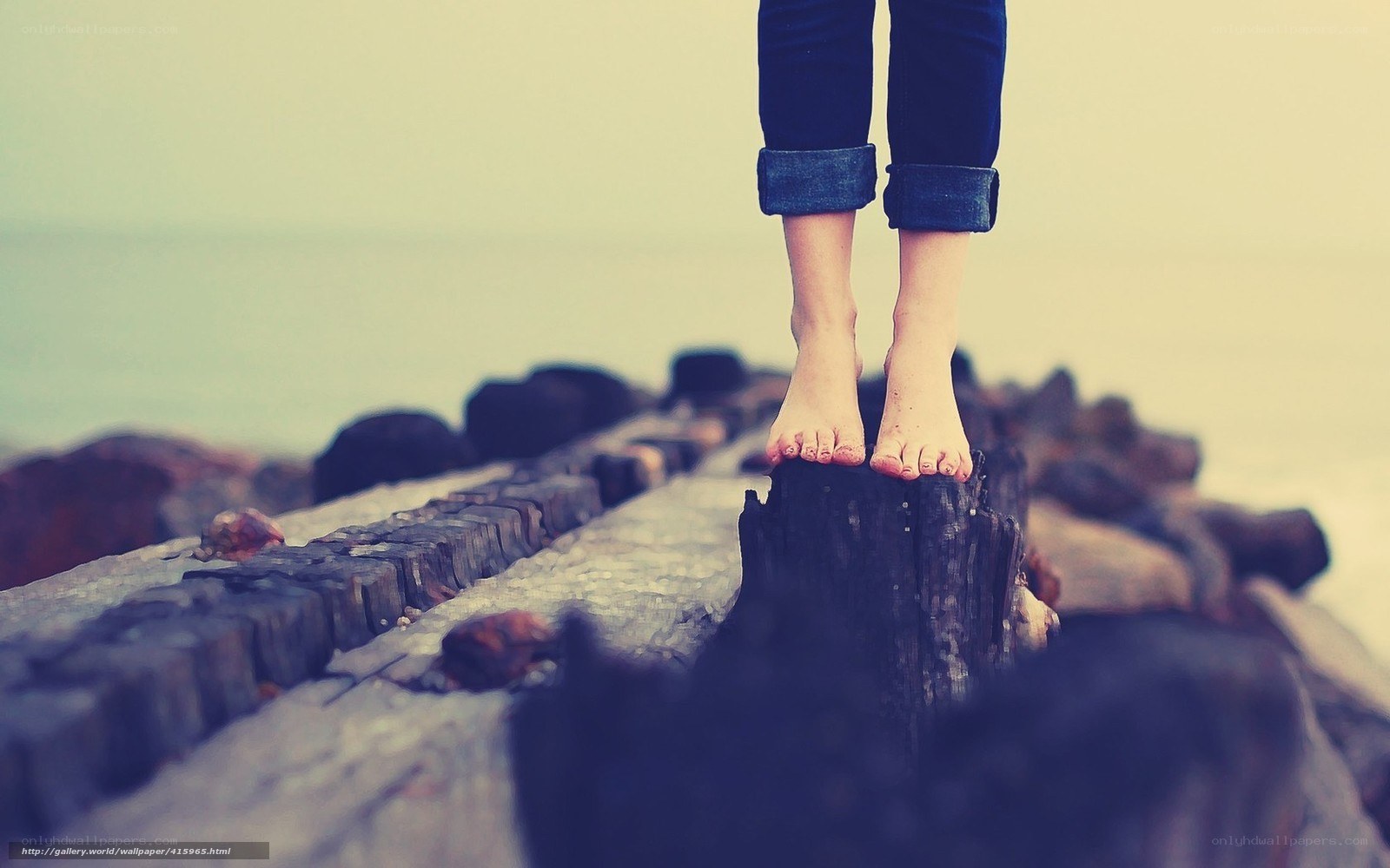 Bare feet on a wooden pier