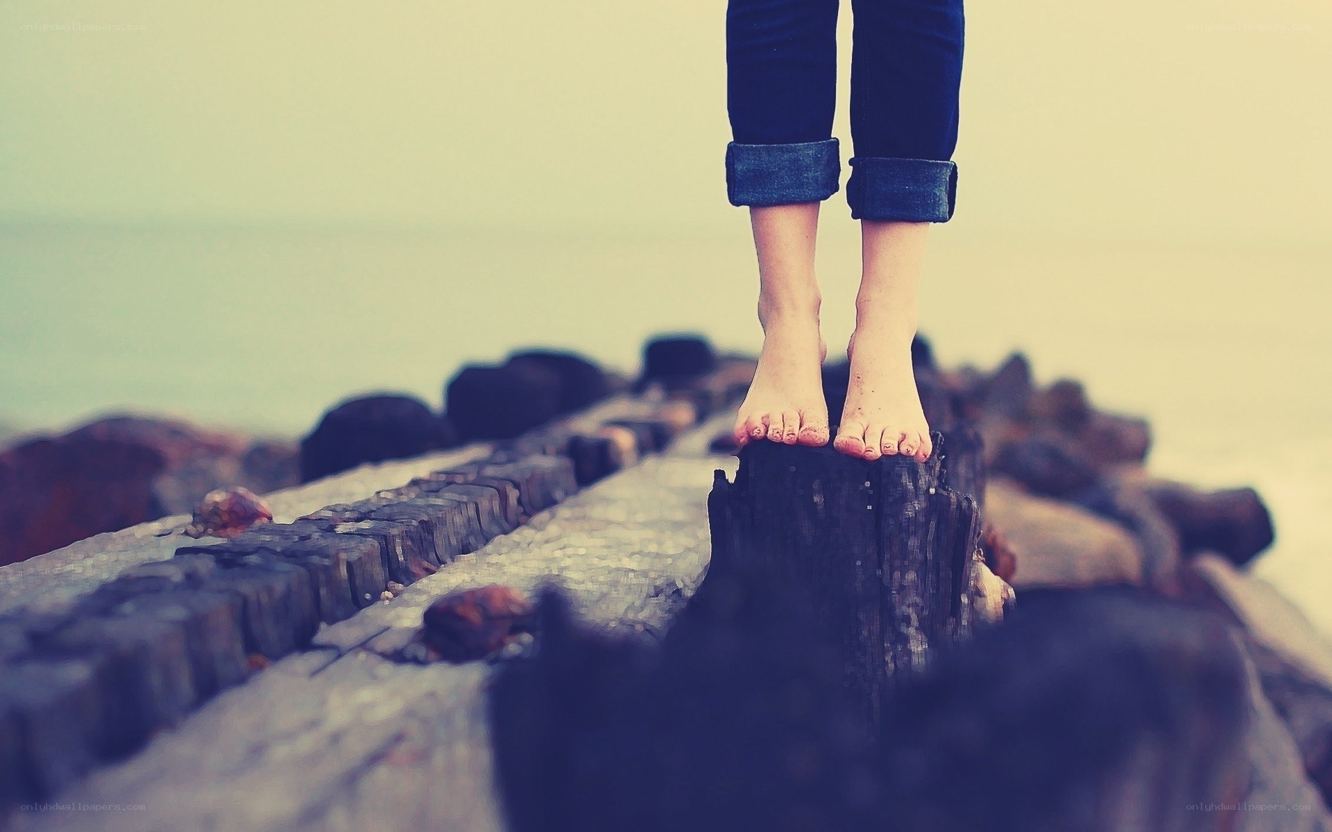 Bare feet on a wooden pier