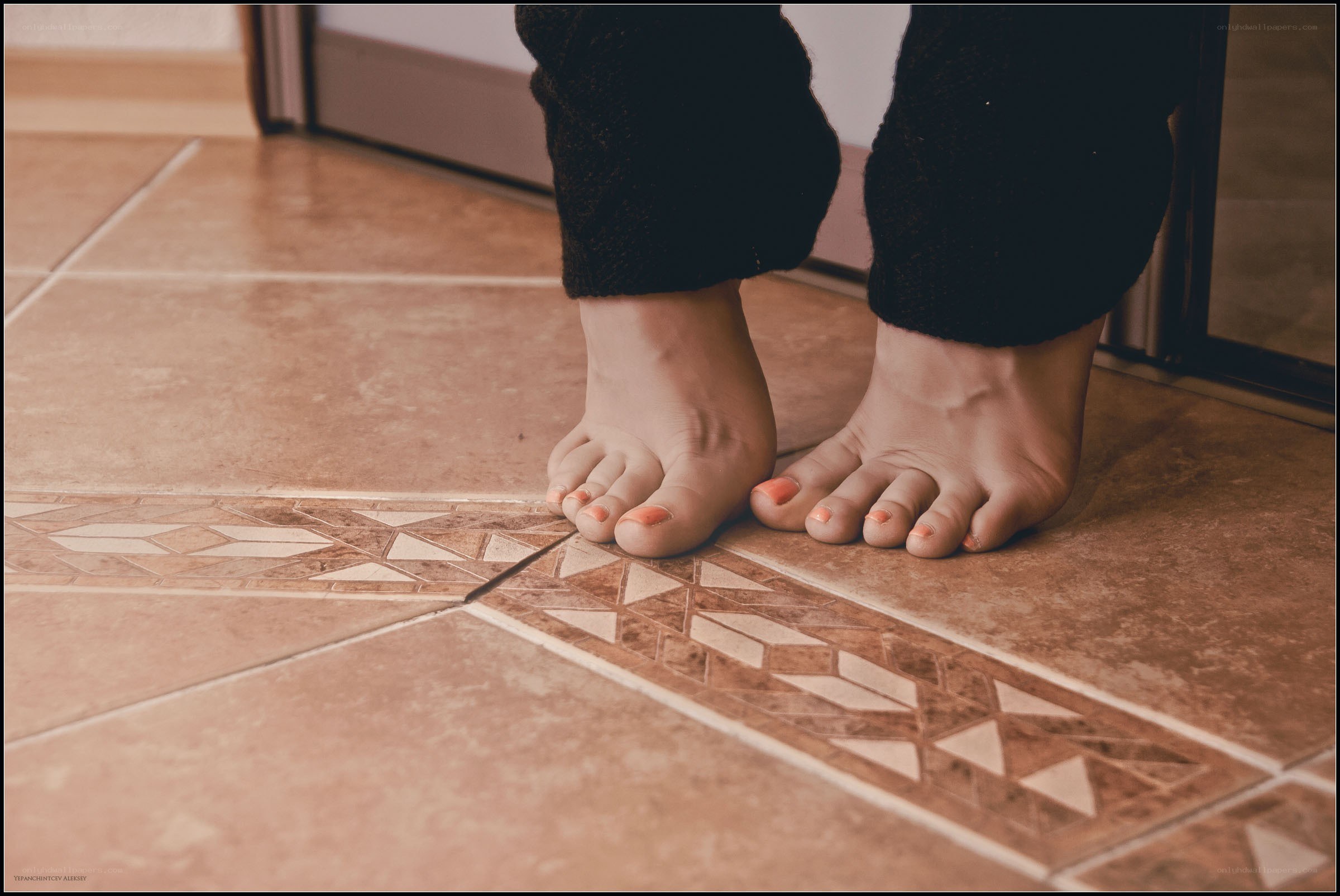 bare feet on tiled floor