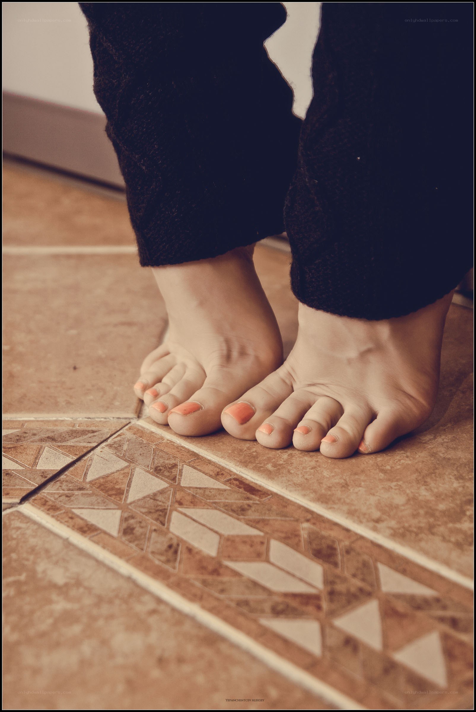 bare feet on tiled floor