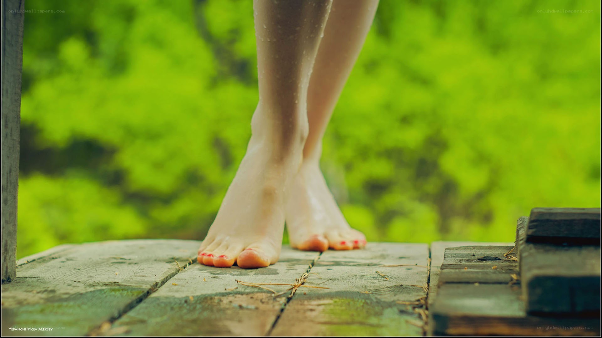 bare feet on wooden deck