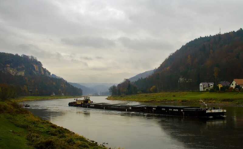 Barge on a river in autumn