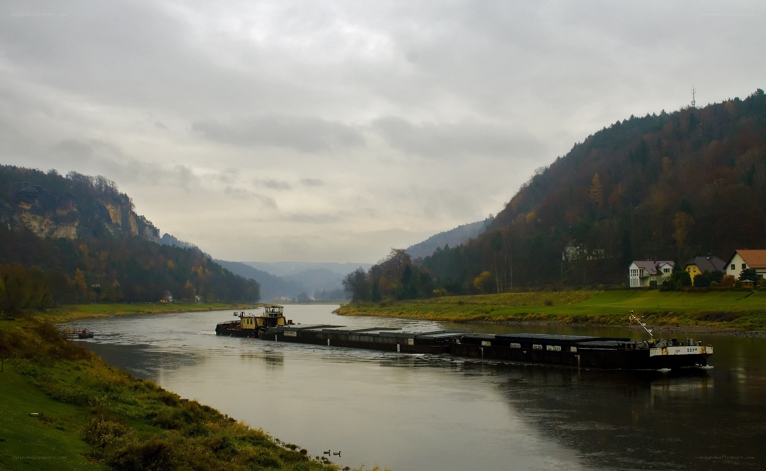 Barge on a river in autumn