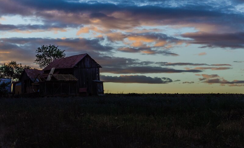 Barn at dusk with colorful sky