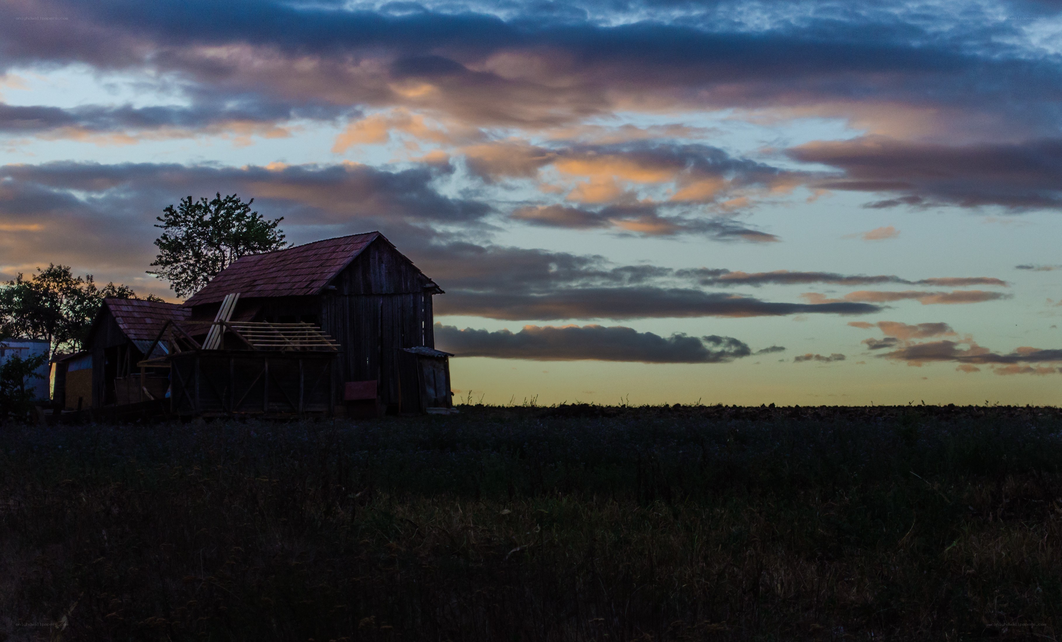 Barn at dusk with colorful sky