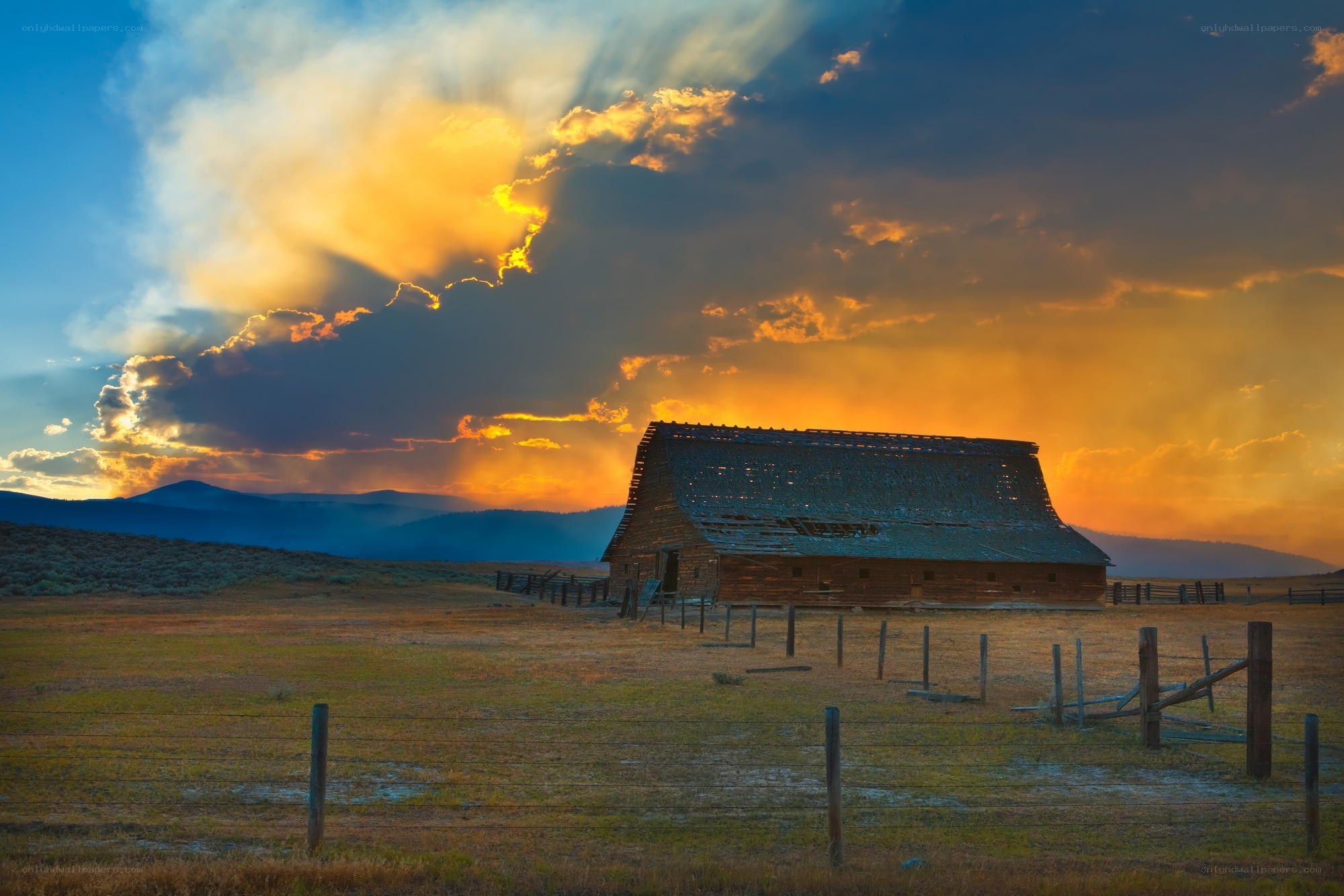 Barn at sunset in the mountains