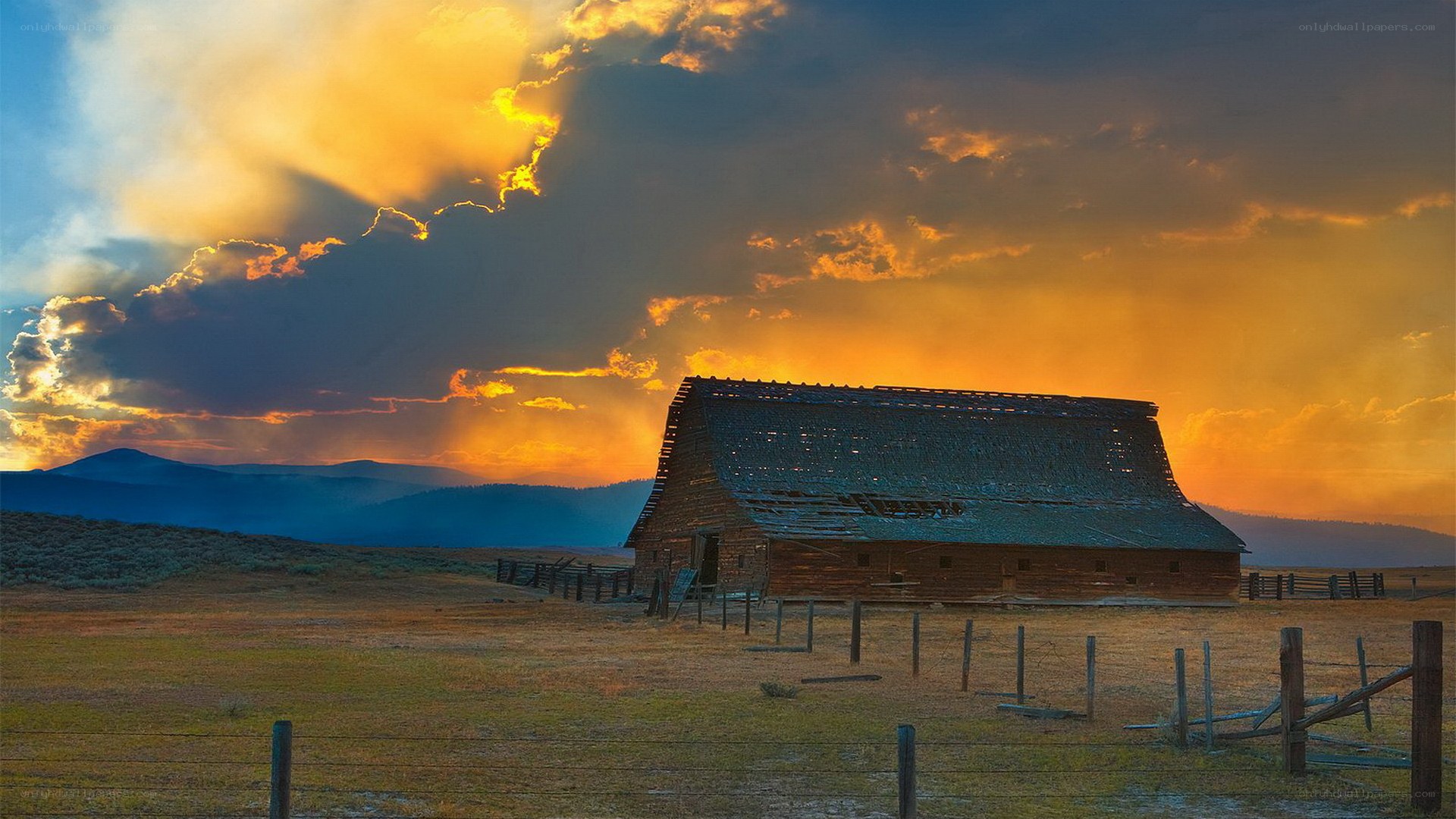 Barn at sunset in the mountains
