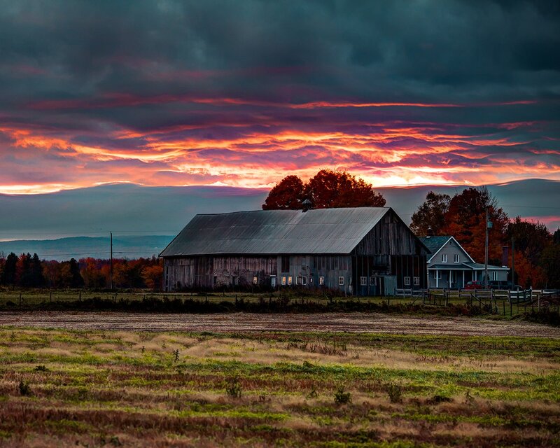 Barn at sunset with colorful sky
