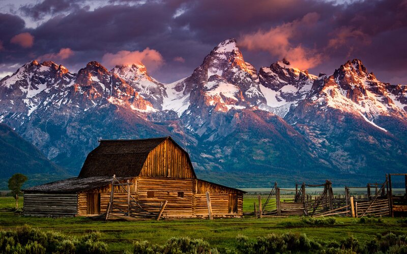 Barn at sunset with mountains