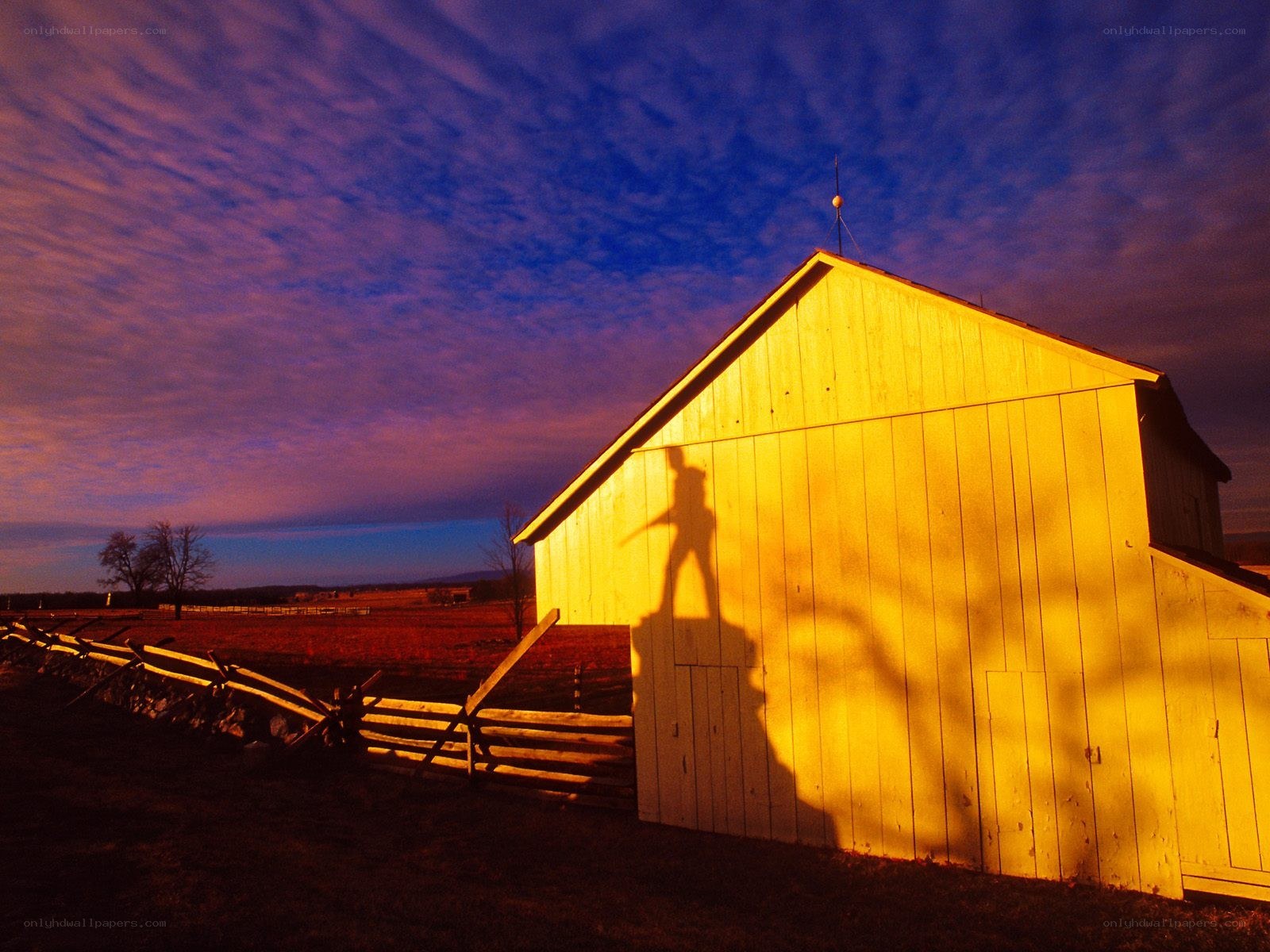 Barn at sunset with shadow