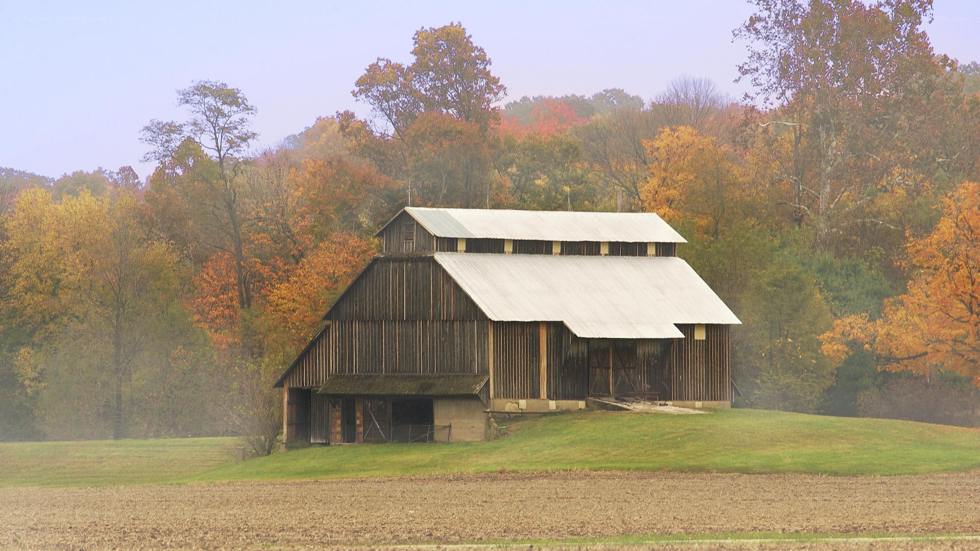 Barn in autumn landscape