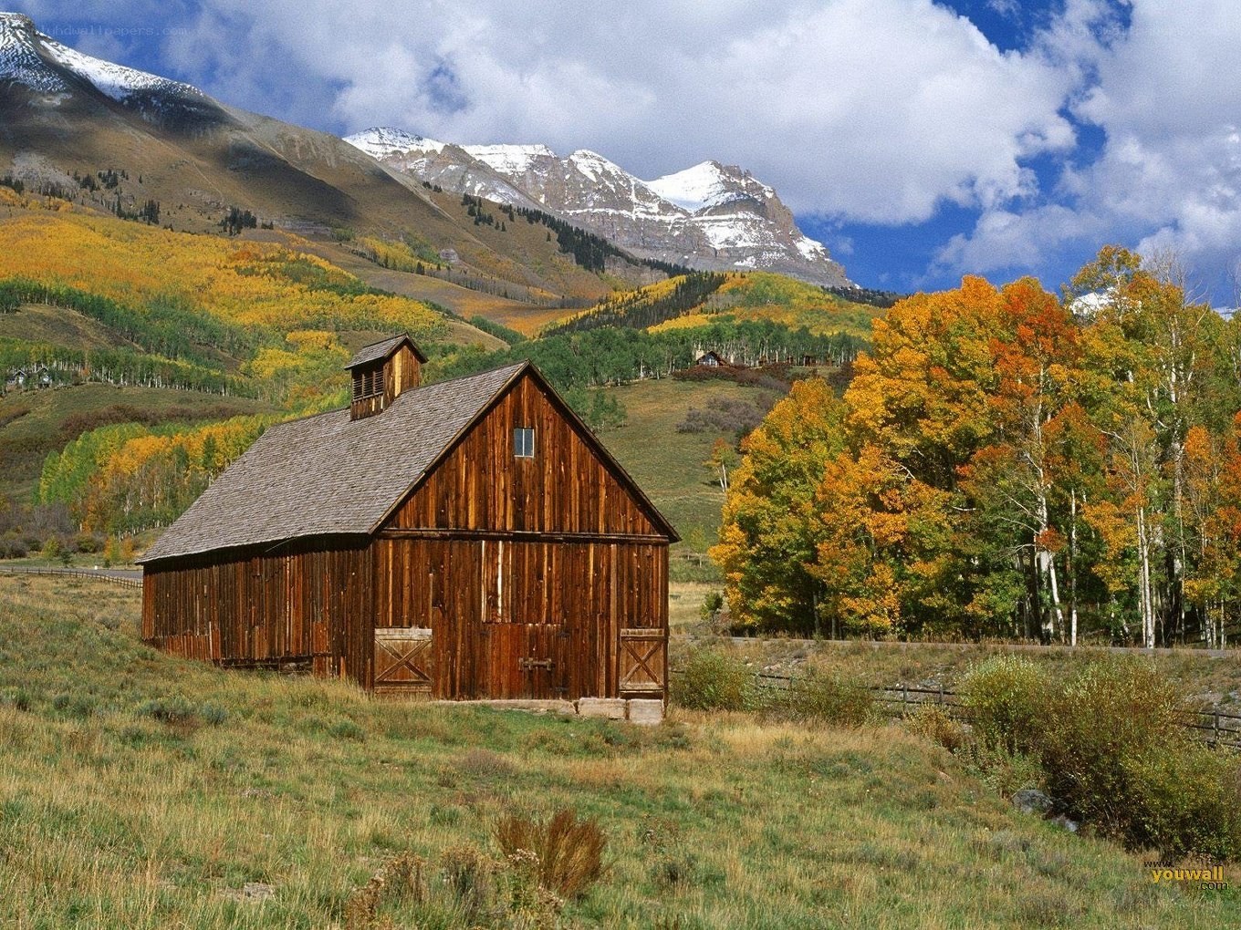 Barn in autumn mountains