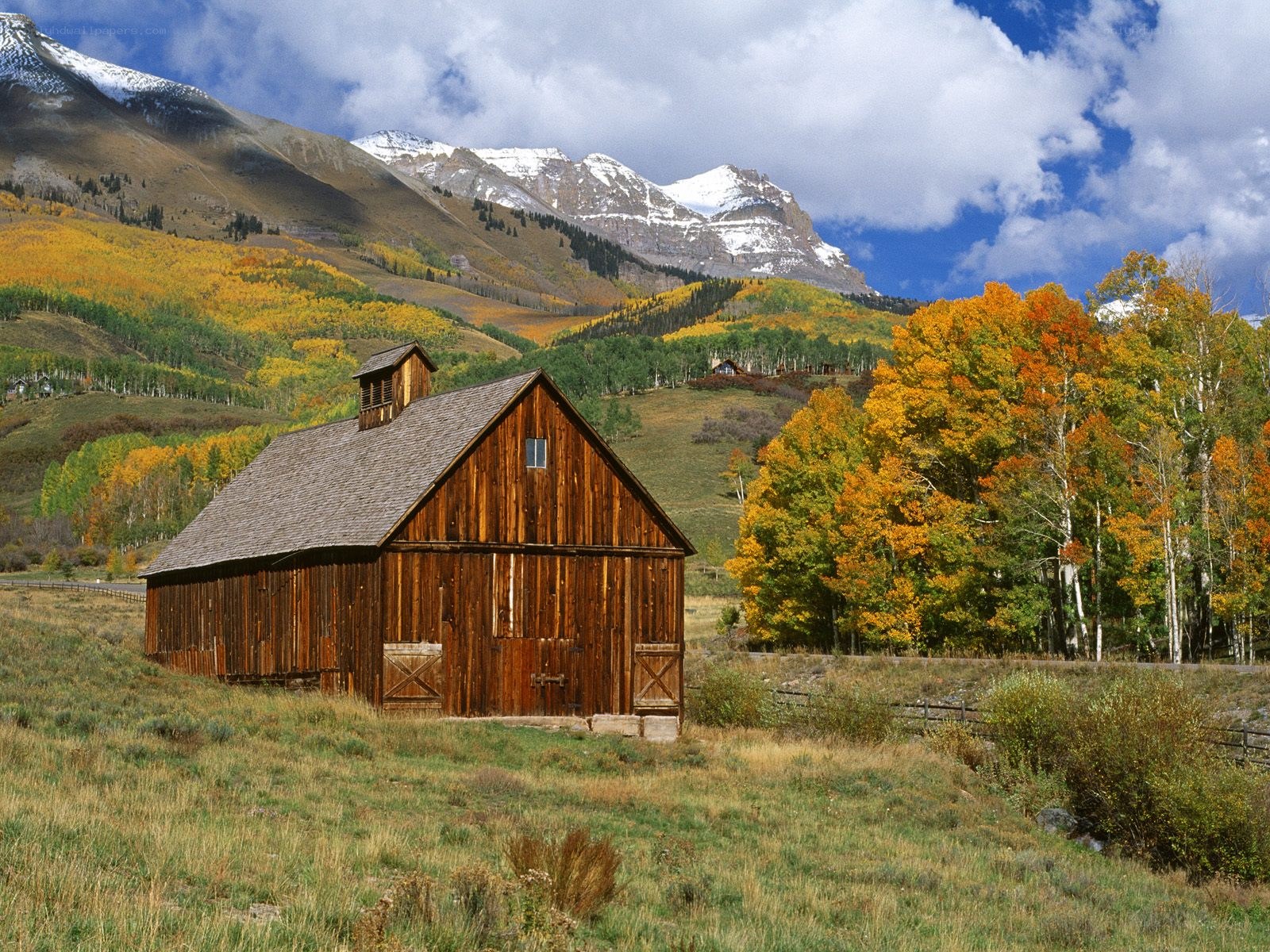 Barn in autumn mountains