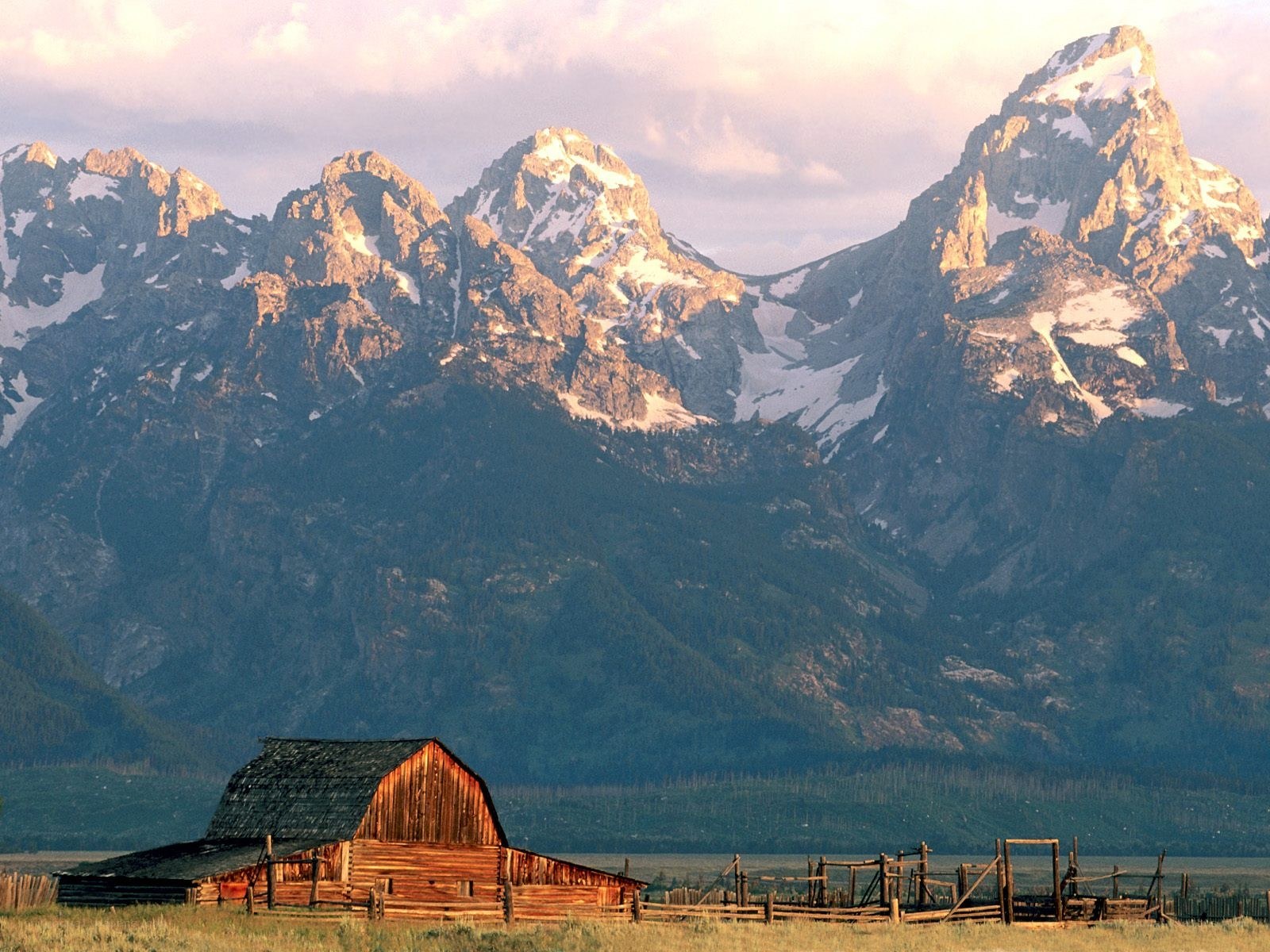 Barn in front of mountain range