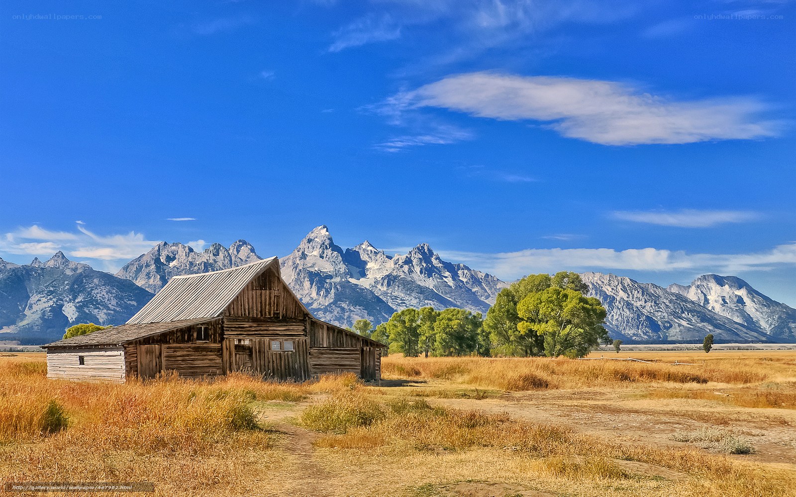 Barn in front of mountain range