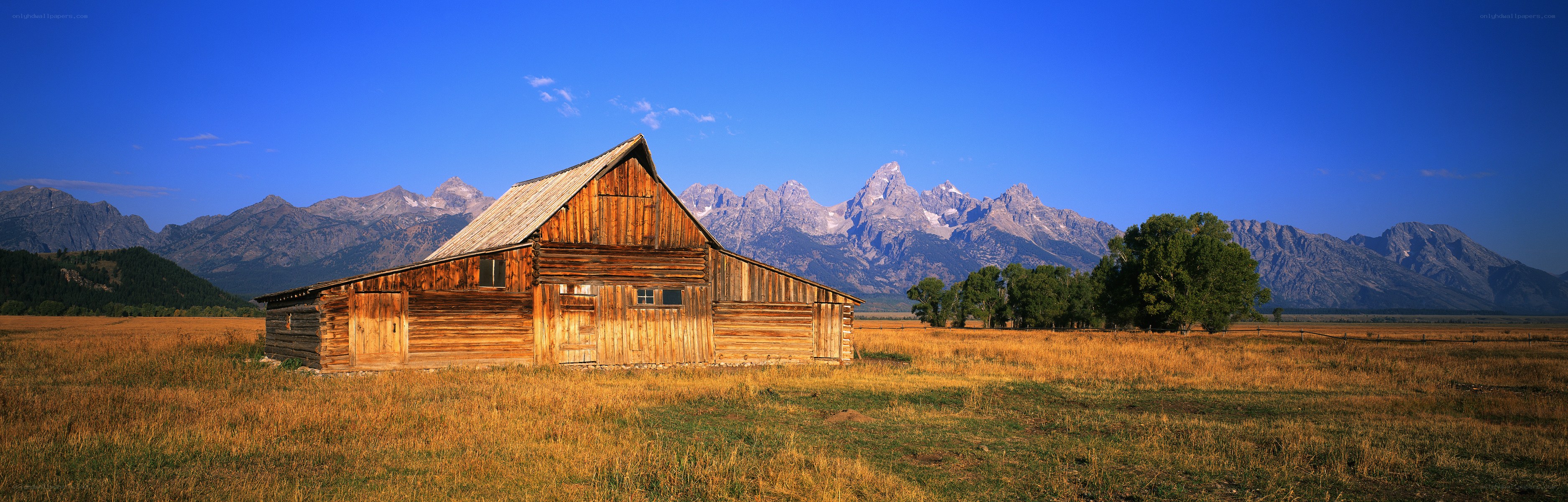 Barn in front of mountains
