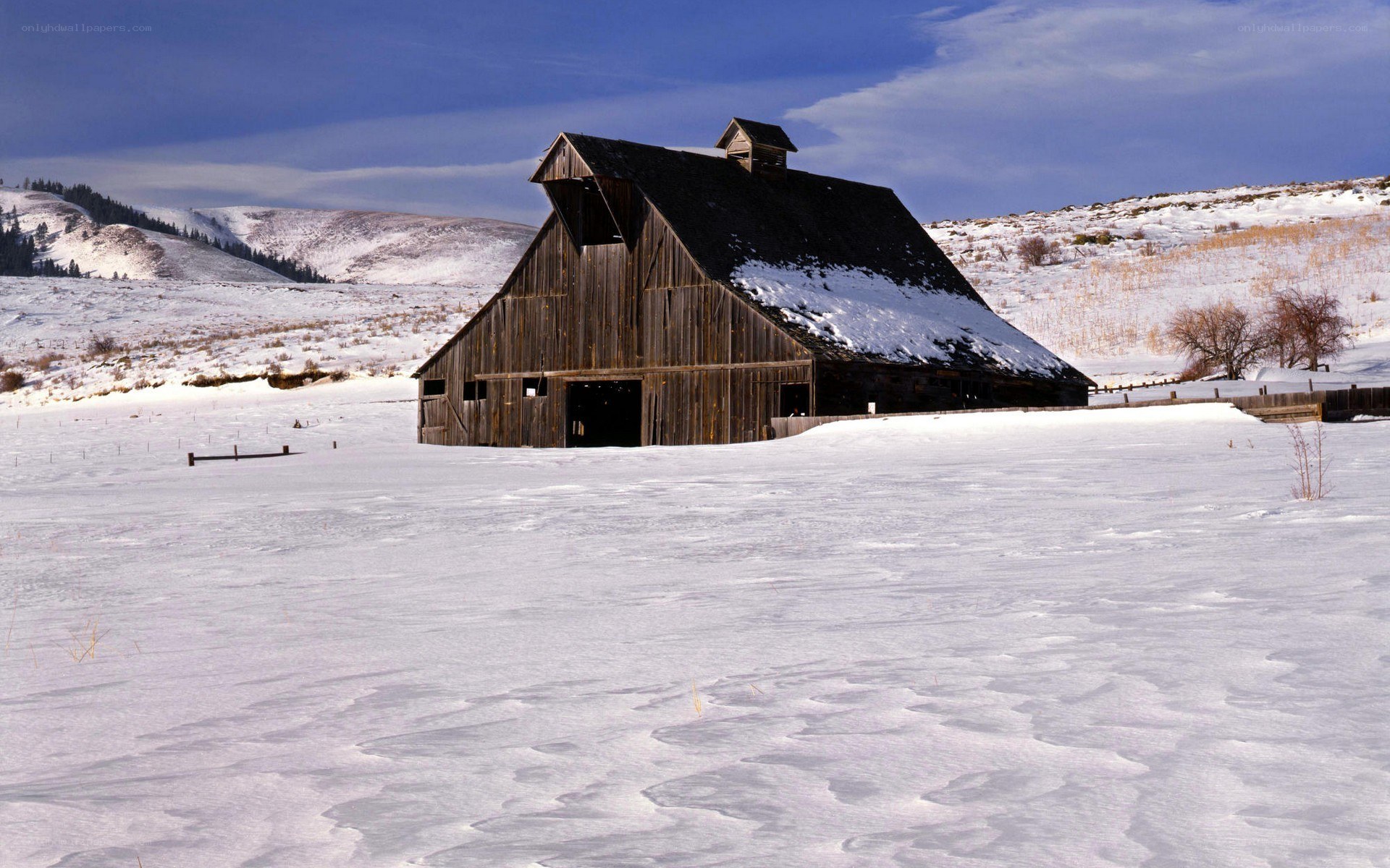Barn in snowy landscape