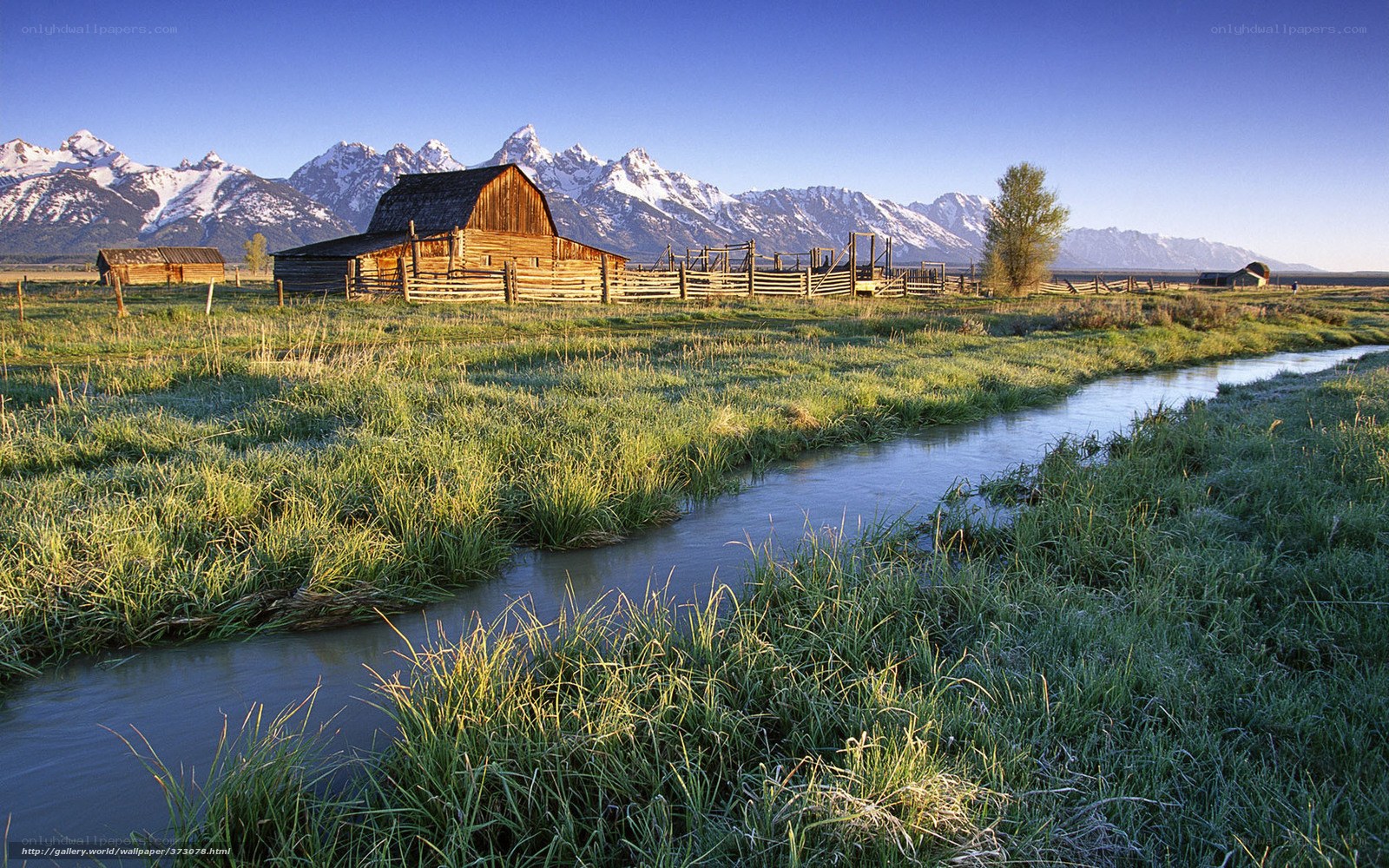 Barn in valley with mountains