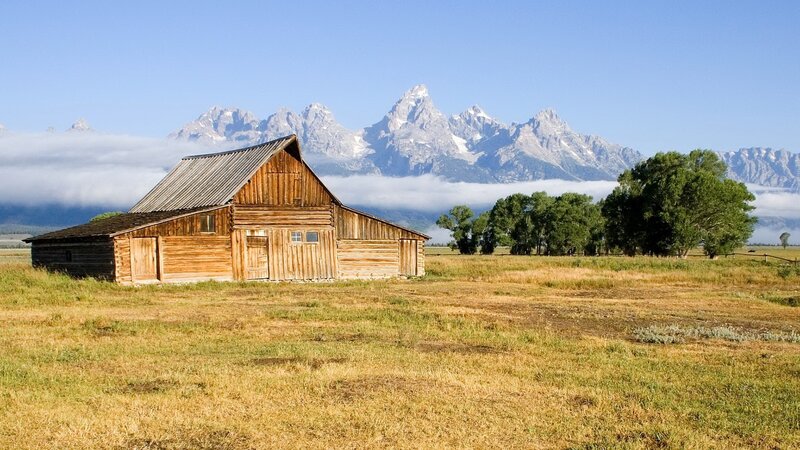 Barn with mountain backdrop