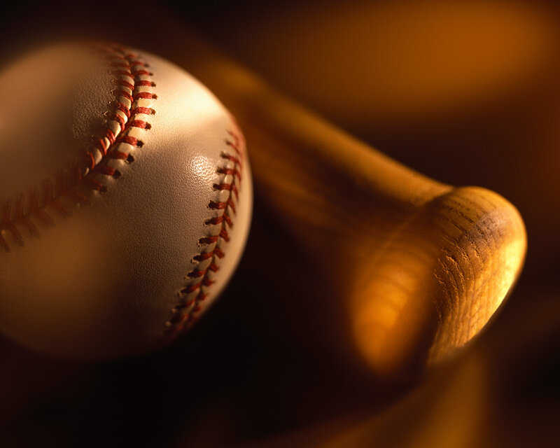 Baseball and bat in warm light