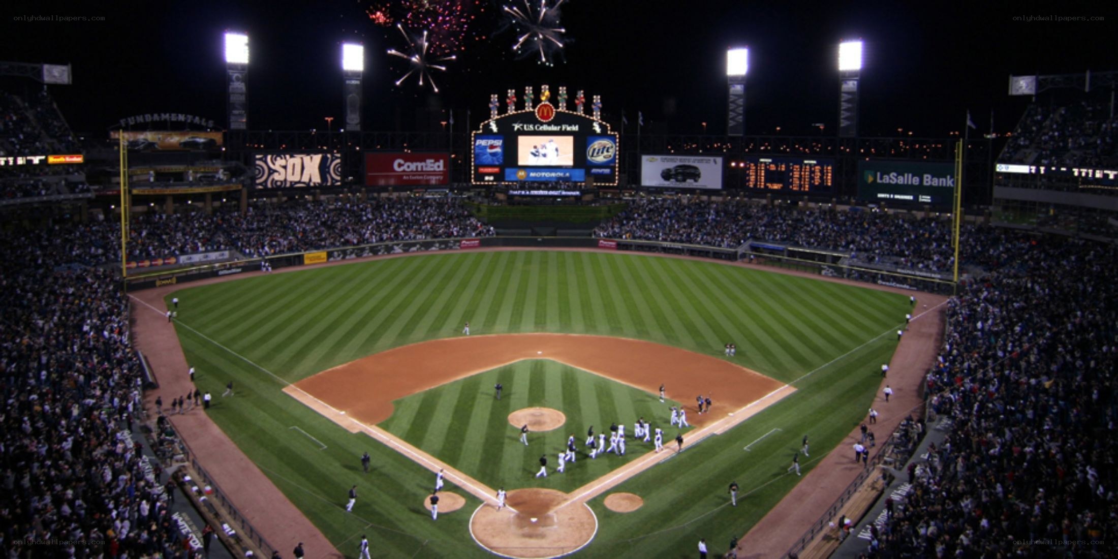 Baseball game at night with fireworks