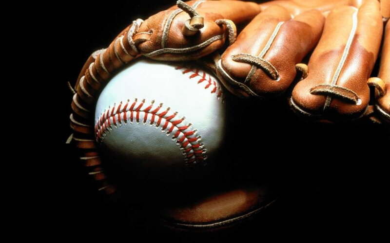 baseball glove holding a ball