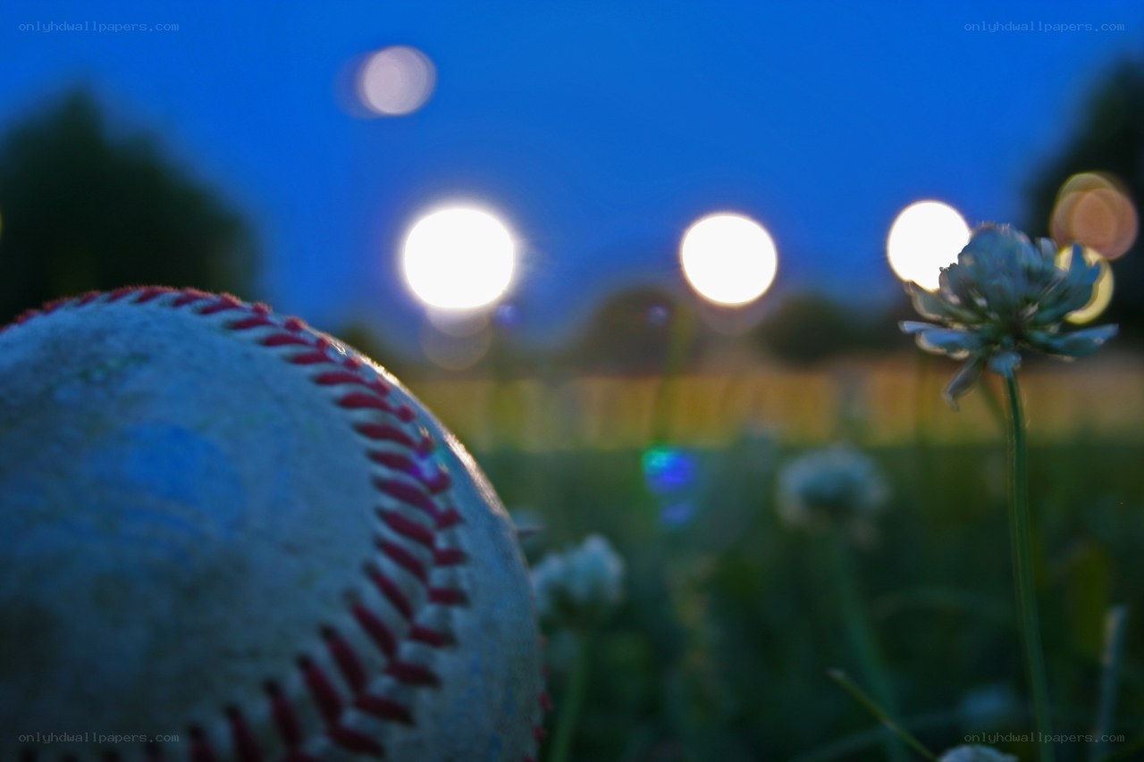 Baseball on a field at dusk