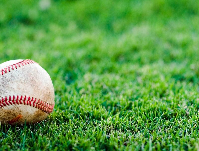 Baseball on green grass