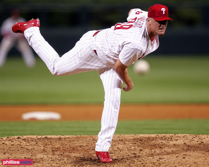Baseball Pitcher Throwing — White, Focused