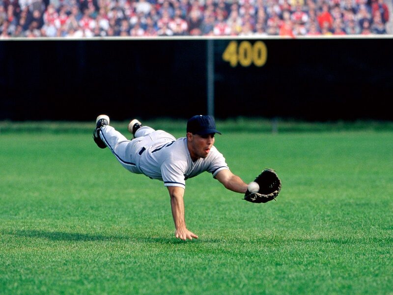 baseball player diving for ball