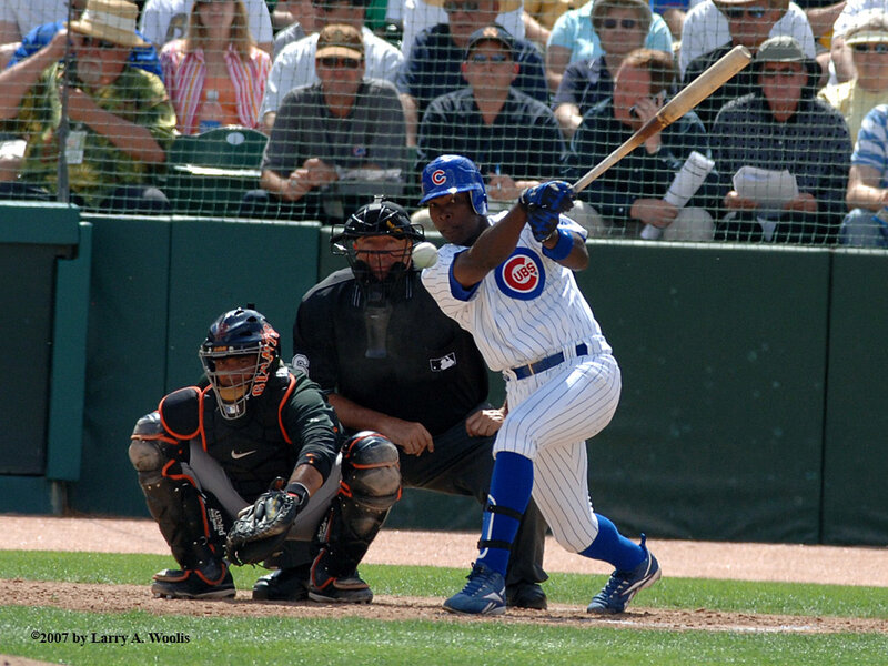 Baseball player hitting a ball