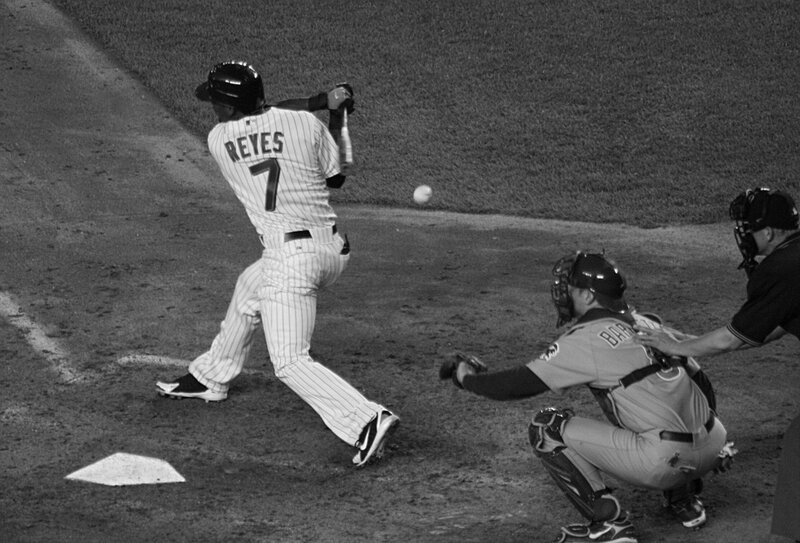 Baseball player hitting a ball