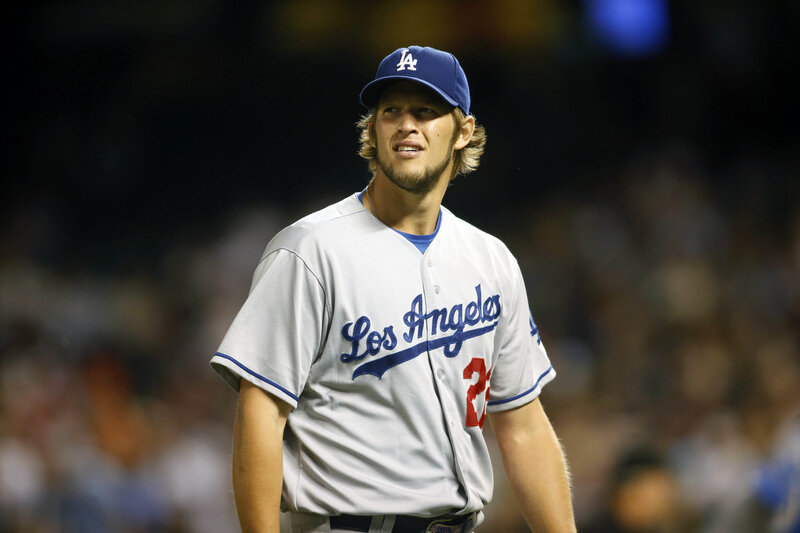 Baseball Player in Uniform — White, Focused