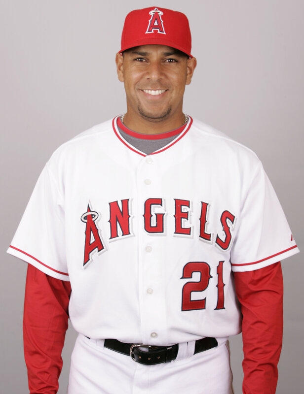 Baseball Player in Uniform — White, Neutral, Photograph, Cap, Jersey, Belt, Red, Black, Portrait
