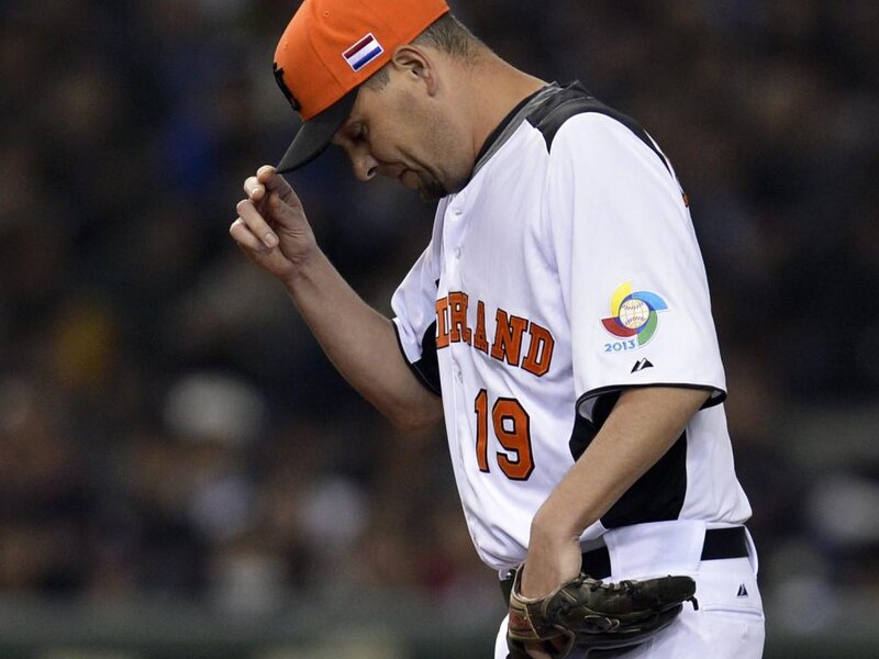 Baseball Player in Uniform — White