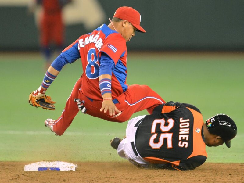 Baseball Players Sliding