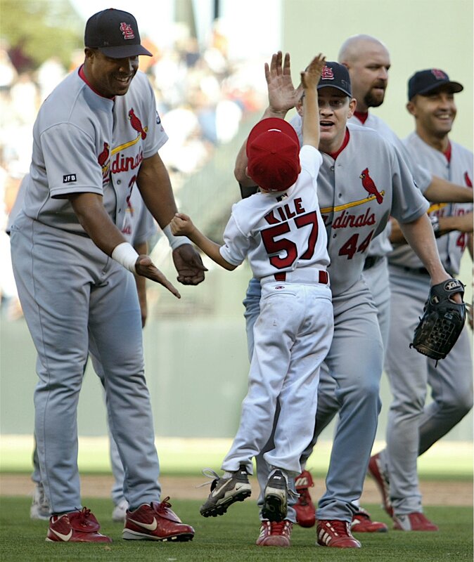 Baseball players with child