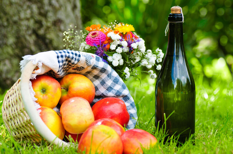 Basket of Apples and Bottle